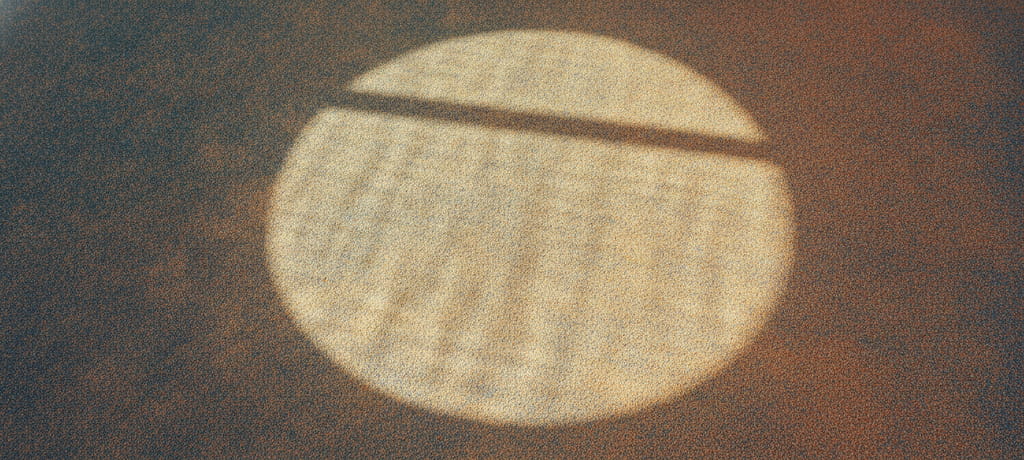 Close-up artistic composition of a sunlit padel court surface with the subtle outline of a round shape drawn in light and shadow, symbolizing balance and focus, warm natural tones, no people, no text, no products